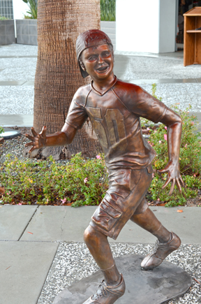 Young Fan running to catch football.